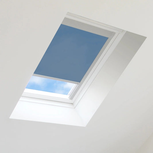 Skylight with a blue blind partially covering it, showing a clear sky outside.