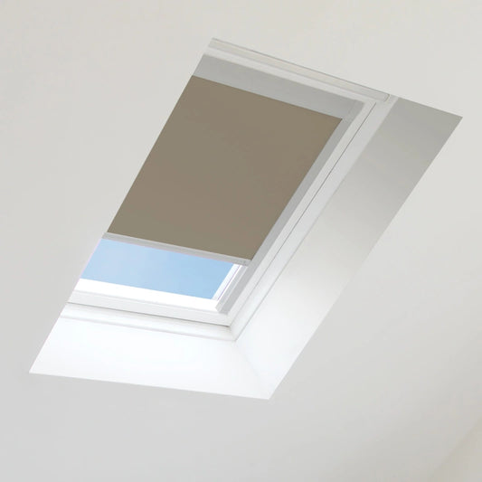 Skylight with a brown blind partially covering it, allowing blue sky to peek through.